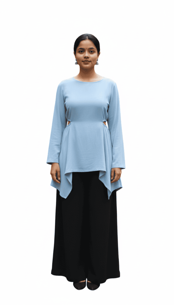 Woman wearing a light blue full-sleeve top paired with black wide-leg pants.